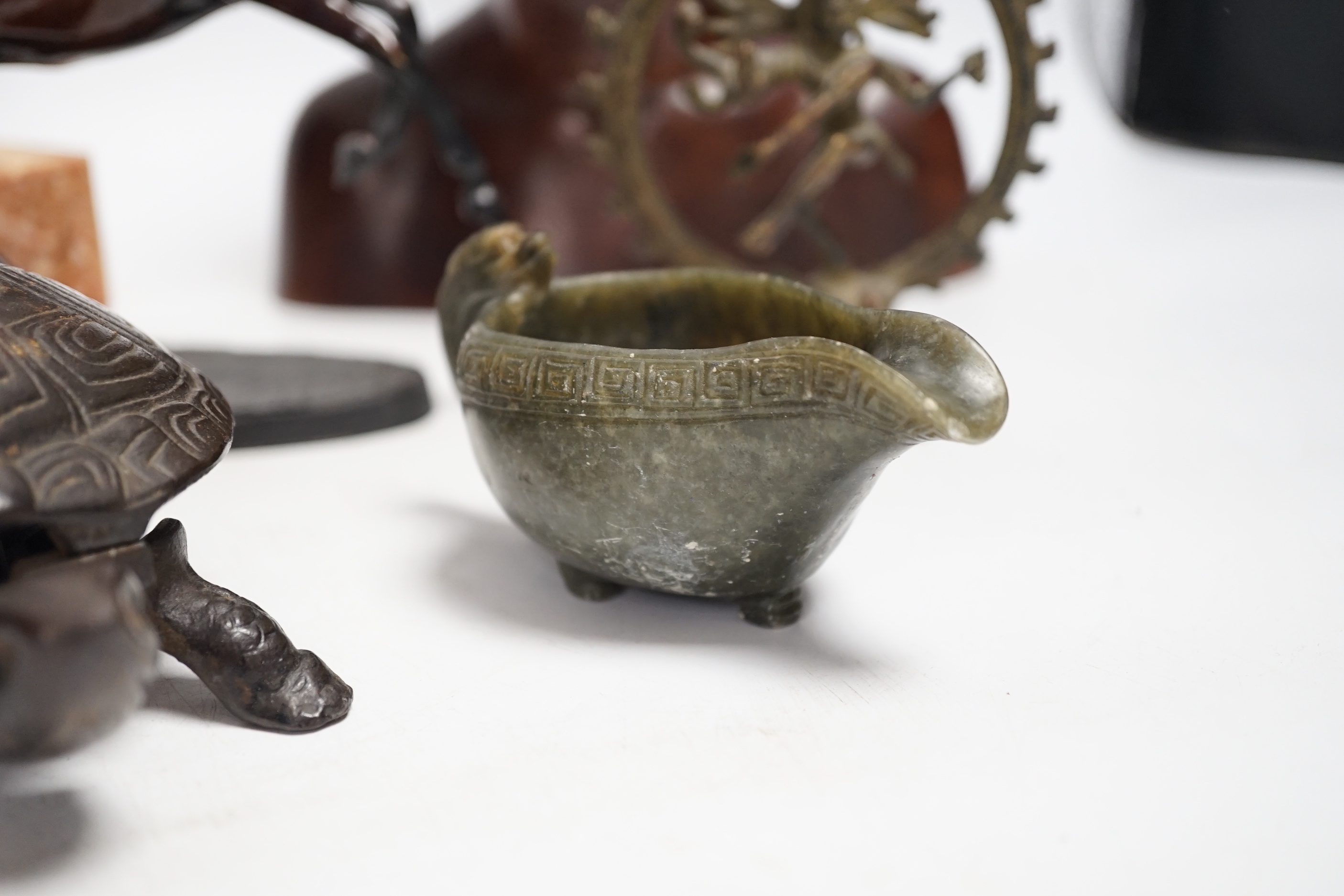 Mixed metal and carved ornaments, including a tortoise table bell, a statue of two dancers and a Balanese head, etc, 22cm
